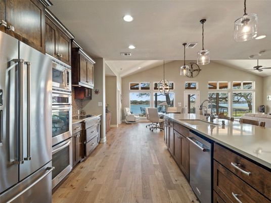 Dining room, Interior, Kitchen, Living room, Pendant Lights, Recessed Lighting, Stainless Steel Appliances, Water, Wood Texture Flooring