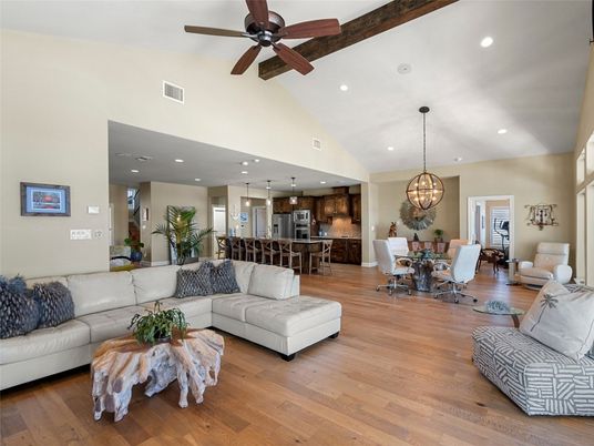 Chandelier, Dining room, Interior, Kitchen, Living room, Pendant Lights, Recessed Lighting, Stainless Steel Appliances, Wood Texture Flooring