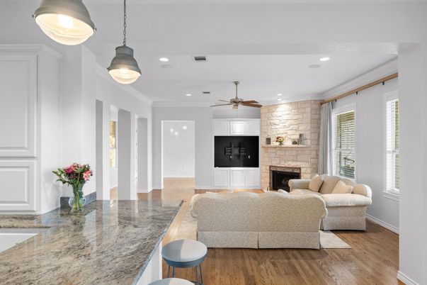Fireplace, Interior, Living room, Pendant Lights, Recessed Lighting, Stone Walls, Wood Texture Flooring