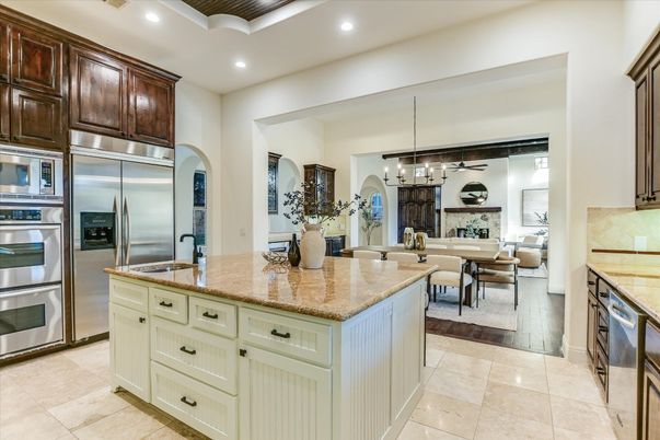 Chandelier, Dining room, Fireplace, Interior, Kitchen, Living room, Pendant Lights, Recessed Lighting, Stainless Steel Appliances
