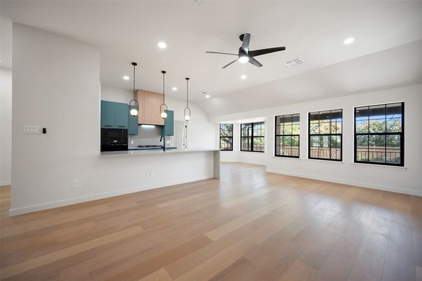 Empty room, Interior, Kitchen, Pendant Lights, Recessed Lighting, Stainless Steel Appliances, Wood Texture Flooring