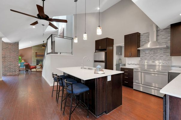 Interior, Kitchen, Pendant Lights, Recessed Lighting, Stainless Steel Appliances, Stone Walls, Wood Texture Flooring