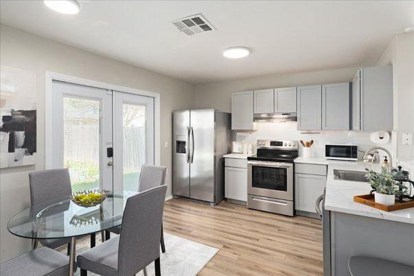 Dining room, Interior, Kitchen, Recessed Lighting, Stainless Steel Appliances, Wood Texture Flooring