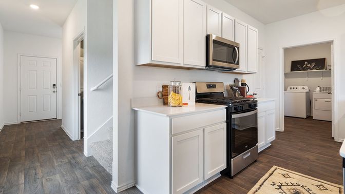 Interior, Kitchen, Recessed Lighting, Washer, Wood Texture Flooring