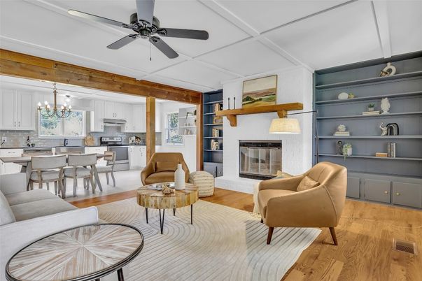 Chandelier, Dining room, Fireplace, Interior, Kitchen, Living room, Pendant Lights, Stainless Steel Appliances, Wood Texture Flooring