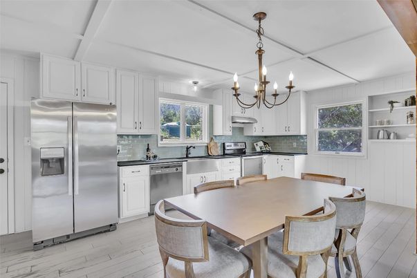 Chandelier, Dining room, Interior, Kitchen, Stainless Steel Appliances, Wood Texture Flooring