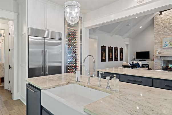 Fireplace, Interior, Kitchen, Recessed Lighting, Stainless Steel Appliances, Stone Walls, Wood Texture Flooring