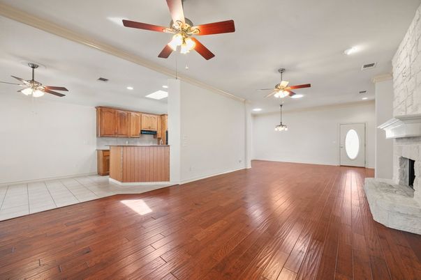 Empty room, Fireplace, Interior, Kitchen, Recessed Lighting, Wood Texture Flooring