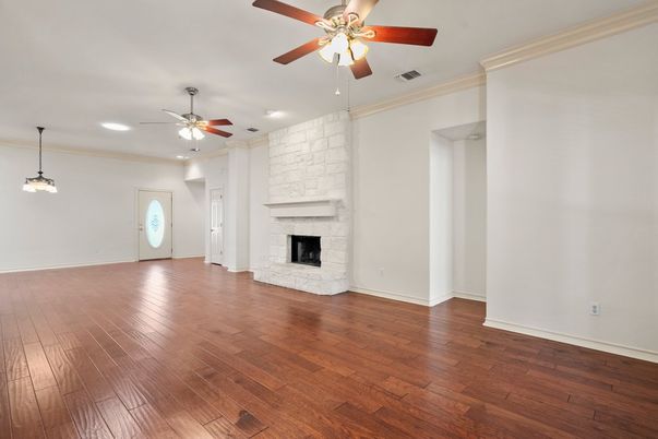 Empty room, Fireplace, Interior, Pendant Lights, Recessed Lighting, Stone Walls, Wood Texture Flooring