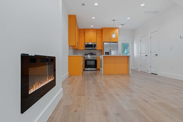 Fireplace, Interior, Kitchen, Pendant Lights, Recessed Lighting, Stainless Steel Appliances, Wood Texture Flooring