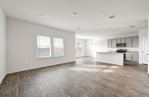 Empty room, Interior, Kitchen, Recessed Lighting, Stainless Steel Appliances, Wood Texture Flooring