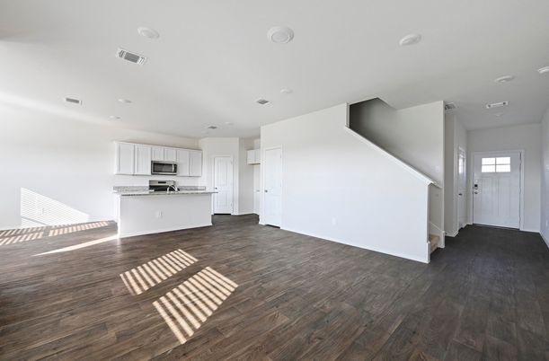 Empty room, Interior, Kitchen, Recessed Lighting, Stainless Steel Appliances, Wood Texture Flooring