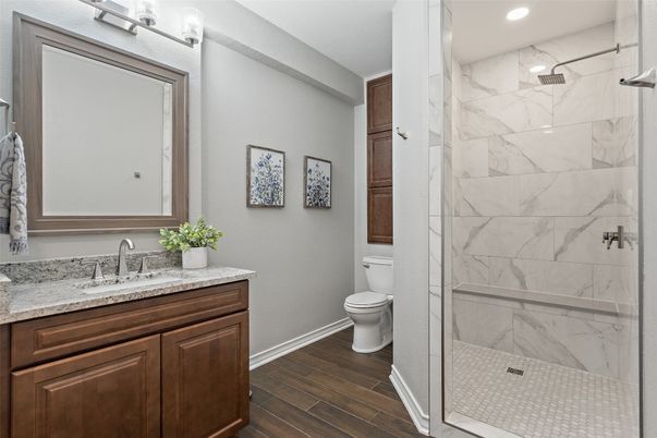 Bathroom, Glass Shower, Interior, Marble Walls, Recessed Lighting, Wood Texture Flooring