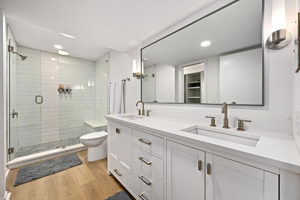 Bathroom, Dual Sink Vanities, Glass Shower, Interior, Recessed Lighting, Wood Texture Flooring