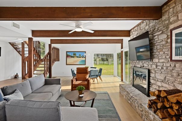 Dining room, Fireplace, Interior, Living room, Recessed Lighting, Stone Walls, Wooden Beams, Wood Texture Flooring