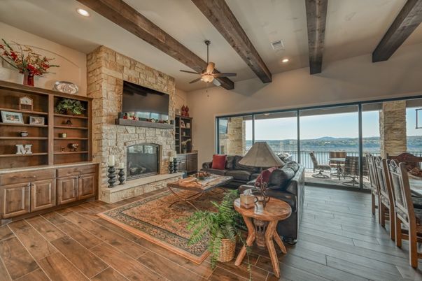 Fireplace, Interior, Living room, Recessed Lighting, Stone Walls, Water, Wooden Beams, Wood Texture Flooring