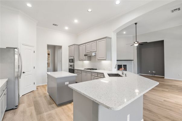 Fireplace, Interior, Kitchen, Recessed Lighting, Wood Texture Flooring