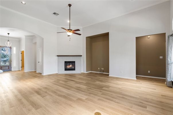 Chandelier, Empty room, Fireplace, Interior, Recessed Lighting, Wood Texture Flooring