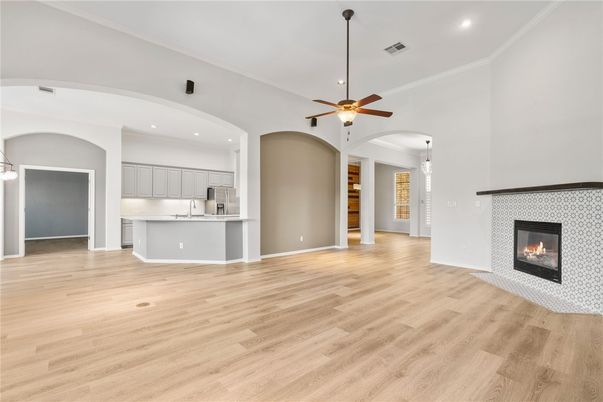 Empty room, Fireplace, Interior, Kitchen, Pendant Lights, Recessed Lighting, Wood Texture Flooring