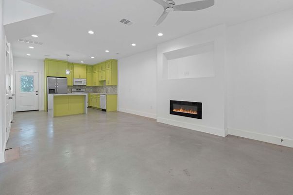 Empty room, Fireplace, Interior, Kitchen, Pendant Lights, Recessed Lighting, Stainless Steel Appliances
