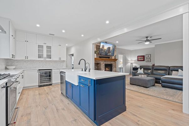 Fireplace, Interior, Kitchen, Living room, Recessed Lighting, Stainless Steel Appliances, Wood Texture Flooring