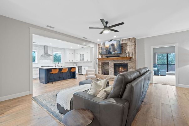Fireplace, Interior, Living room, Recessed Lighting, Stone Walls, Wood Texture Flooring