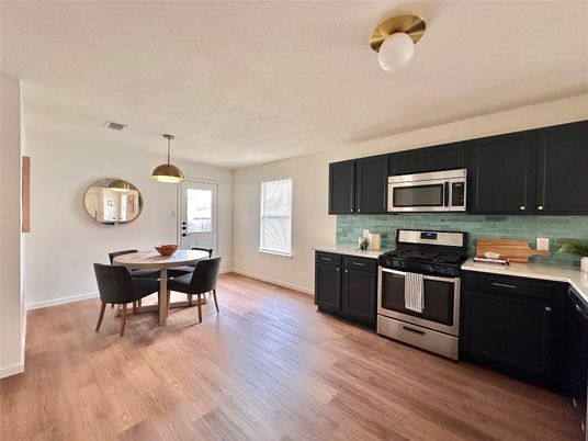 Dining room, Interior, Kitchen, Pendant Lights, Stainless Steel Appliances, Wood Texture Flooring