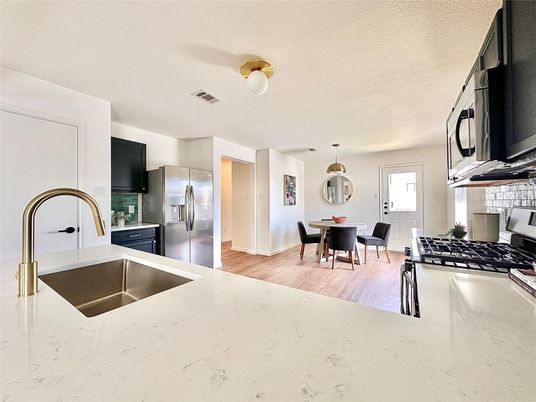 Dining room, Interior, Kitchen, Pendant Lights, Stainless Steel Appliances, Wood Texture Flooring