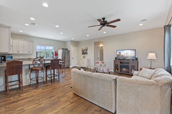 Dining room, Fireplace, Interior, Kitchen, Living room, Recessed Lighting, Wood Texture Flooring