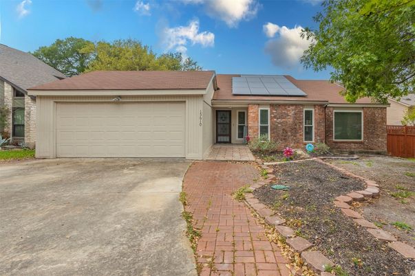 Attached, Exterior, Facade, Brick Facade, Solar Panels, Ranch