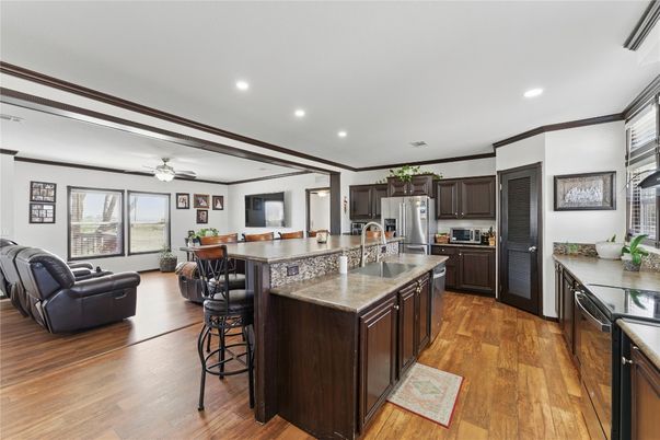 Dining room, Interior, Kitchen, Living room, Recessed Lighting, Stainless Steel Appliances, Wood Texture Flooring