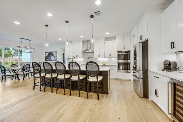 Dining room, Interior, Kitchen, Pendant Lights, Recessed Lighting, Stainless Steel Appliances, Wood Texture Flooring