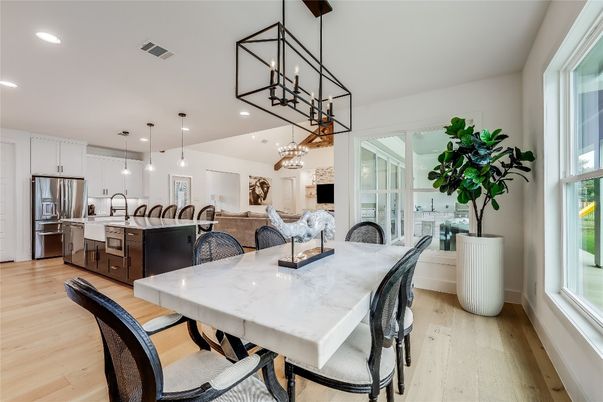 Chandelier, Dining room, Interior, Kitchen, Pendant Lights, Recessed Lighting, Stainless Steel Appliances, Wood Texture Flooring