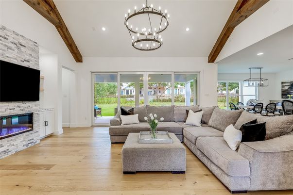 Dining room, Fireplace, Interior, Living room, Pendant Lights, Recessed Lighting, Stone Walls, Wooden Beams, Wood Texture Flooring