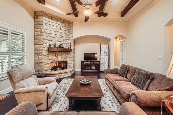 Fireplace, Interior, Living room, Recessed Lighting, Stone Walls, Wood Texture Flooring