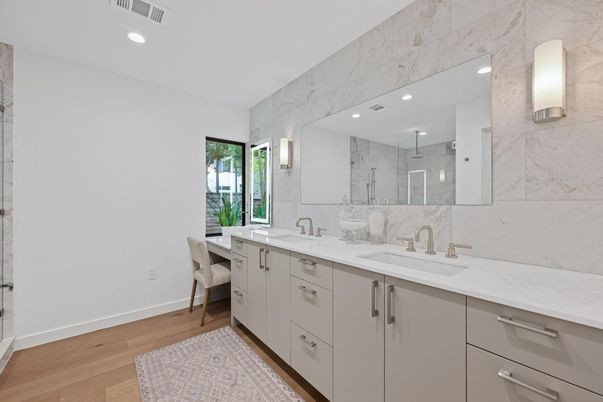 Bathroom, Dual Sink Vanities, Interior, Marble Walls, Recessed Lighting, Wood Texture Flooring
