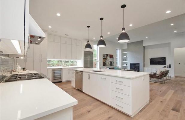 Fireplace, Interior, Kitchen, Living room, Pendant Lights, Recessed Lighting, Stainless Steel Appliances, Wood Texture Flooring