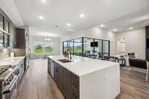 Chandelier, Dining room, Interior, Kitchen, Pendant Lights, Recessed Lighting, Stainless Steel Appliances, Wood Texture Flooring