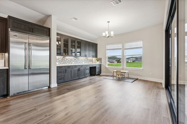 Chandelier, Dining room, Interior, Kitchen, Stainless Steel Appliances, Wood Texture Flooring