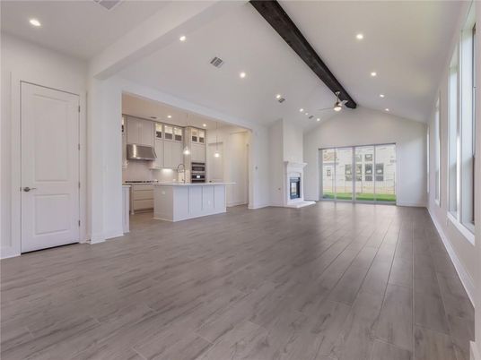 Empty room, Fireplace, Interior, Kitchen, Pendant Lights, Recessed Lighting, Stainless Steel Appliances, Wooden Beams, Wood Texture Flooring