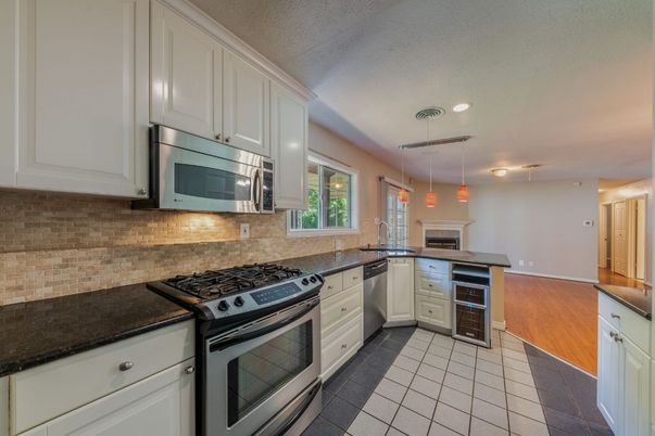 Fireplace, Interior, Kitchen, Pendant Lights, Recessed Lighting, Stainless Steel Appliances