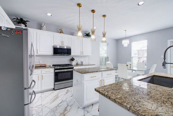 Chandelier, Dining room, Interior, Kitchen, Marble, Pendant Lights, Recessed Lighting, Stainless Steel Appliances