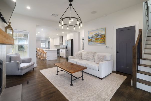 Chandelier, Dining room, Interior, Kitchen, Living room, Pendant Lights, Recessed Lighting, Stainless Steel Appliances, Wood Texture Flooring