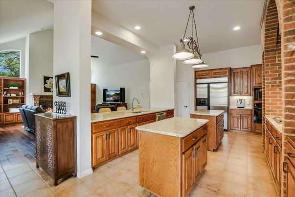 Fireplace, Interior, Kitchen, Pendant Lights, Recessed Lighting, Stainless Steel Appliances, Stone Walls