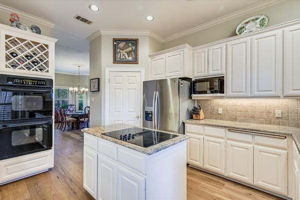 Chandelier, Dining room, Interior, Kitchen, Recessed Lighting, Stainless Steel Appliances, Wood Texture Flooring