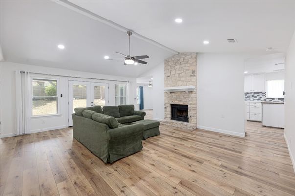 Fireplace, Interior, Kitchen, Living room, Recessed Lighting, Stone Walls, Wood Texture Flooring