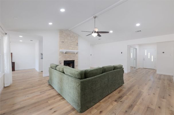 Fireplace, Interior, Living room, Recessed Lighting, Stone Walls, Wood Texture Flooring