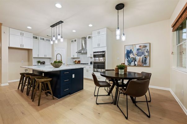 Dining room, Interior, Kitchen, Pendant Lights, Recessed Lighting, Stainless Steel Appliances, Wood Texture Flooring