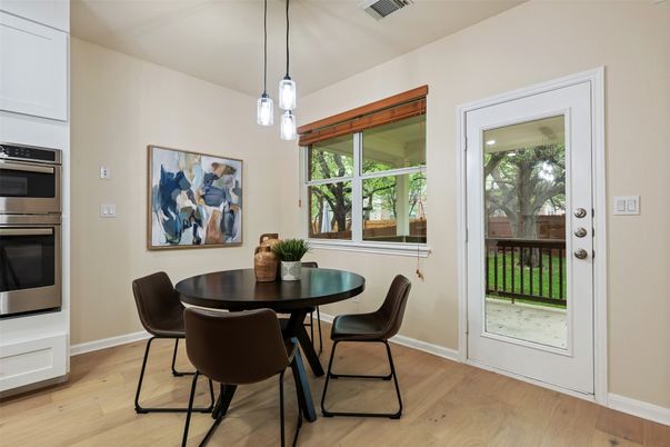 Dining room, Interior, Pendant Lights, Stainless Steel Appliances, Wood Texture Flooring