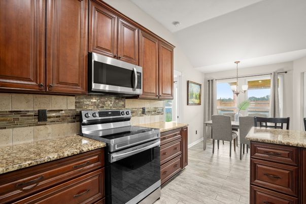 Dining room, Interior, Kitchen, Pendant Lights, Stainless Steel Appliances, Wood Texture Flooring